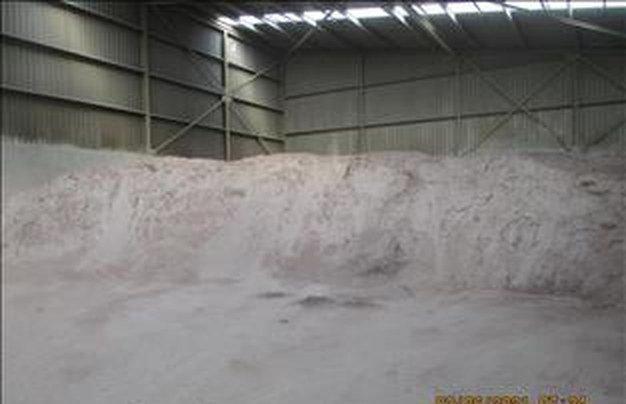 Fluorspar stockpile in a covered warehouse