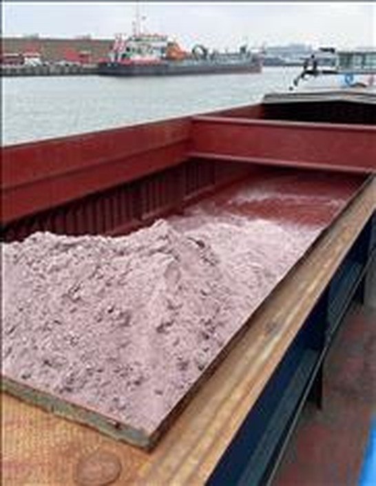 Fluorspar loaded in the open hold of a bulk vessel