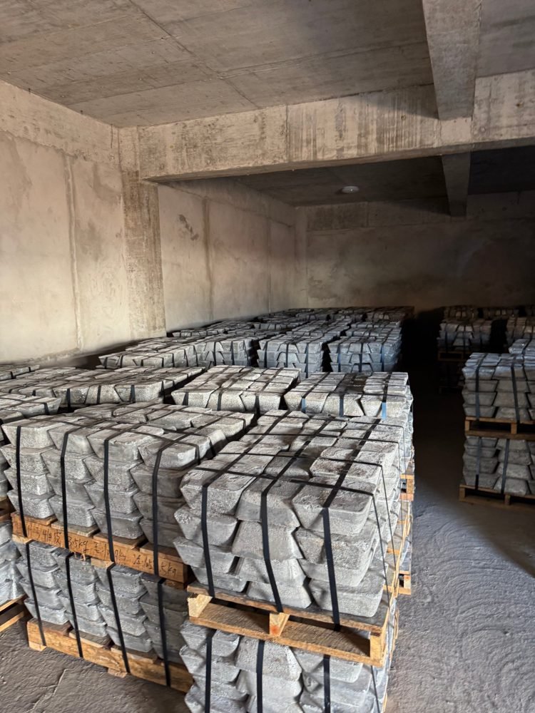Strapped pallets of antimony ingots in a warehouse